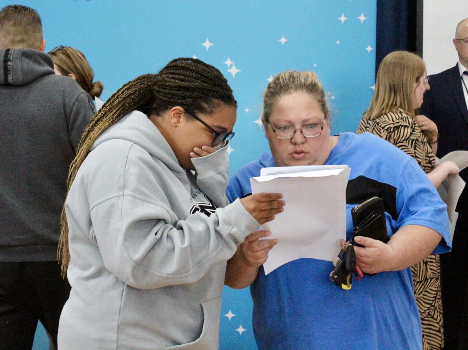 Students holding their results