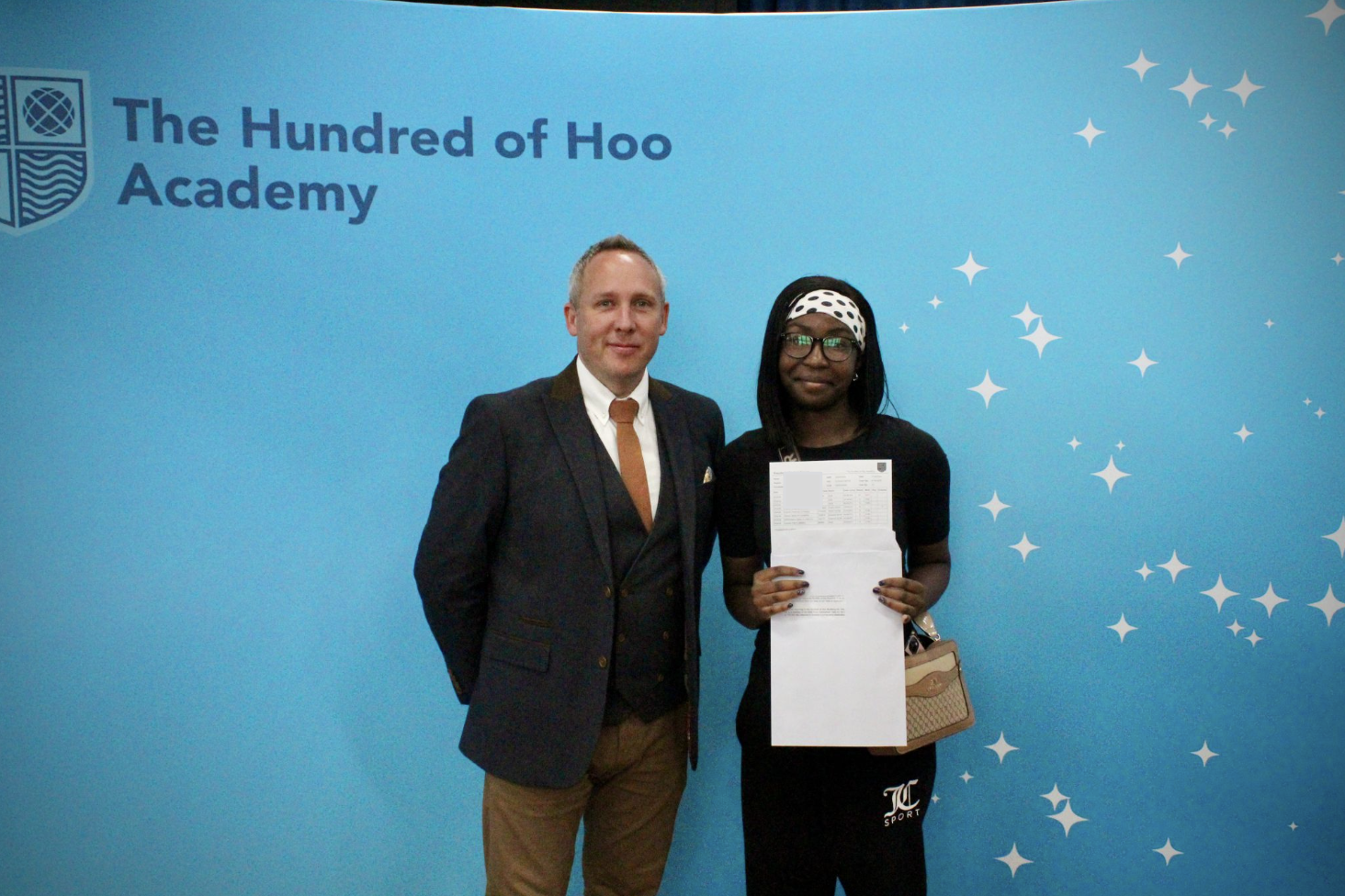 Students holding their results